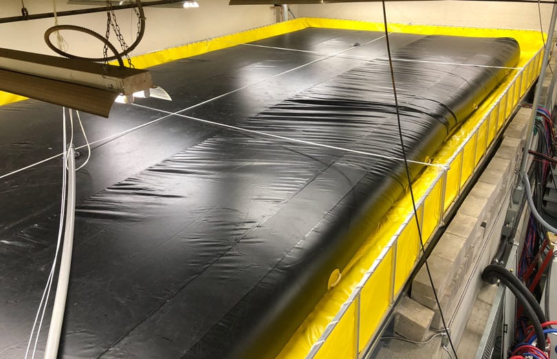 A bladder tank with a folding frame tank offers protection